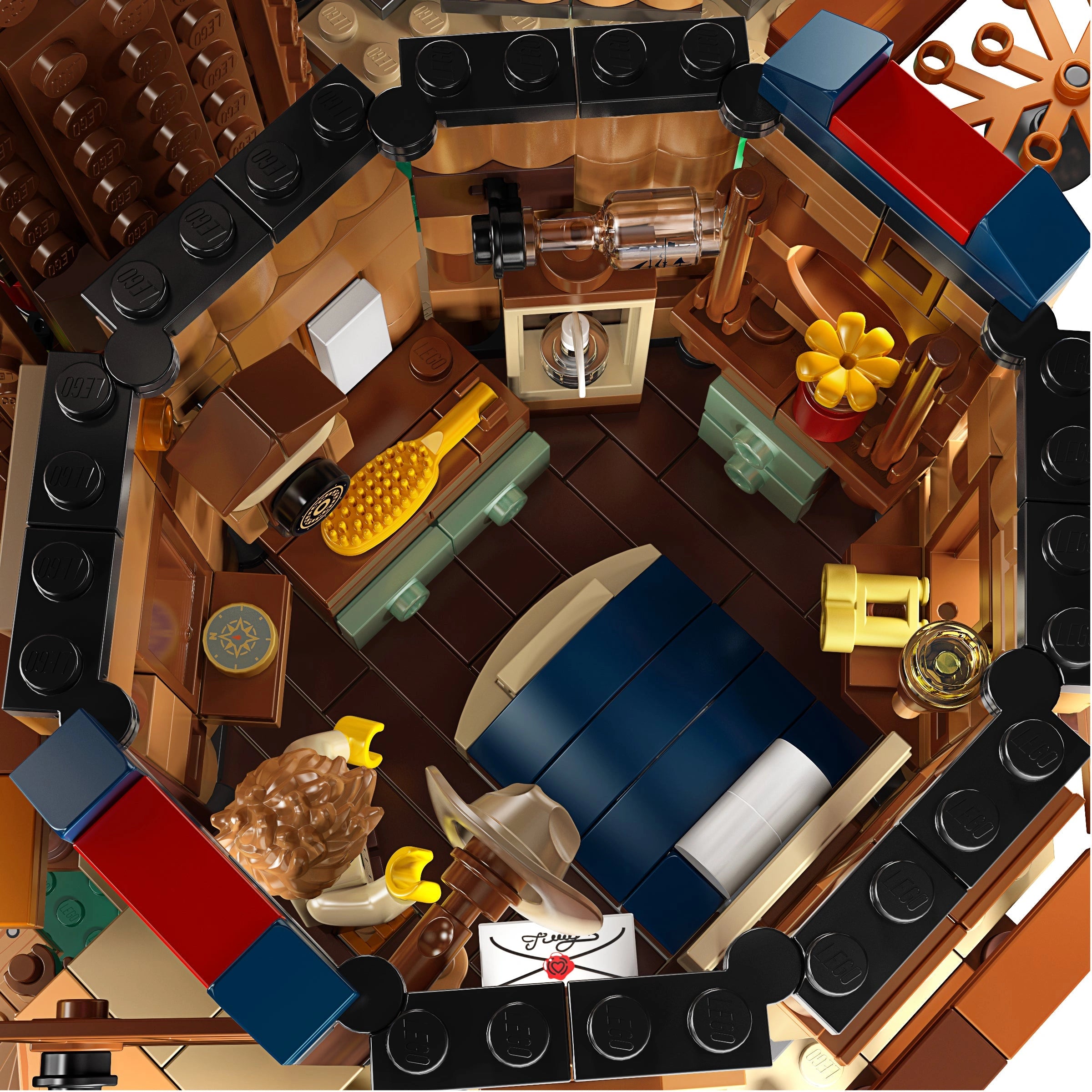 Top-down view of a detailed LEGO model of a living room with furniture and decor.