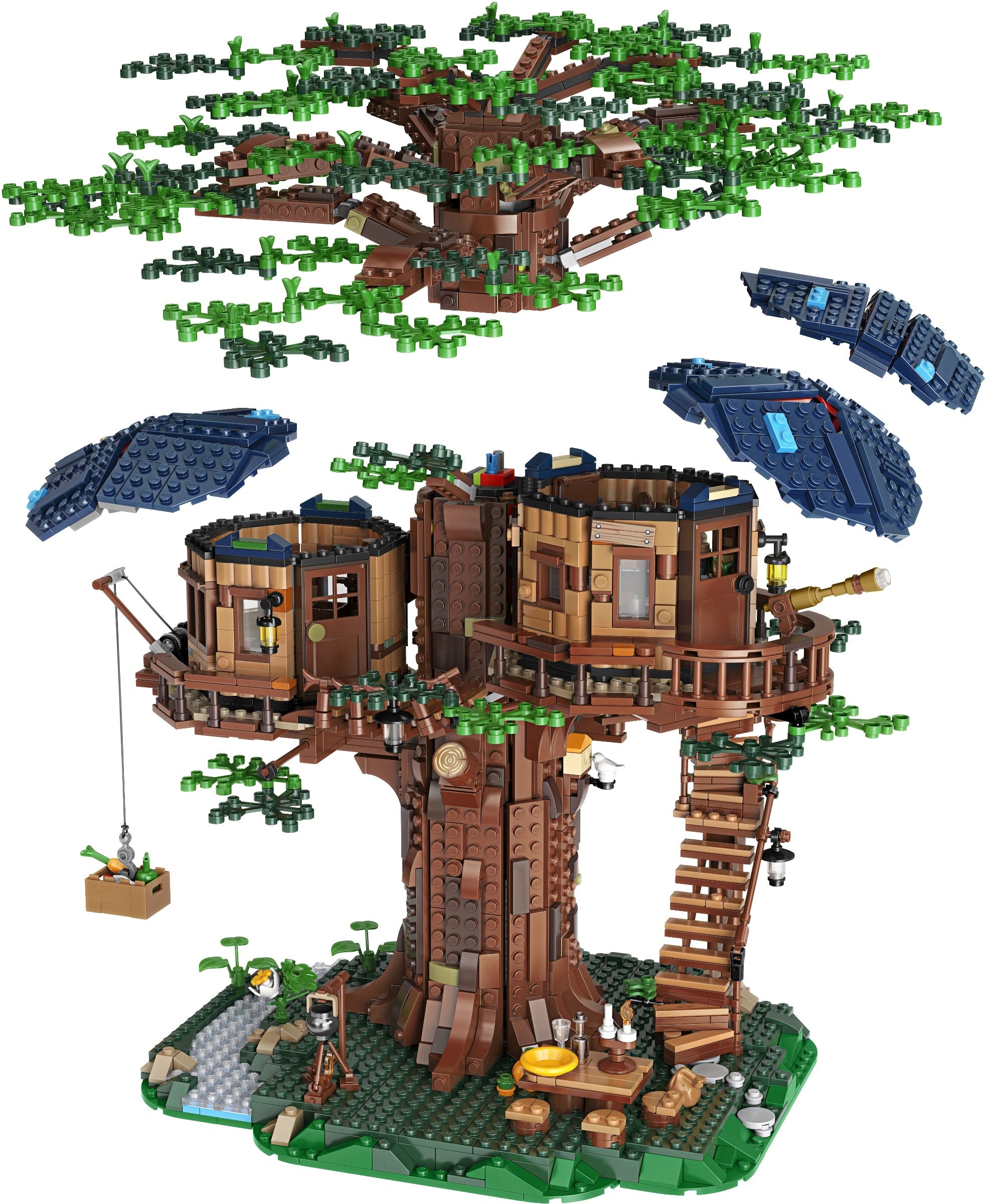Treehouse model made from interlocking bricks with greenery on a white background