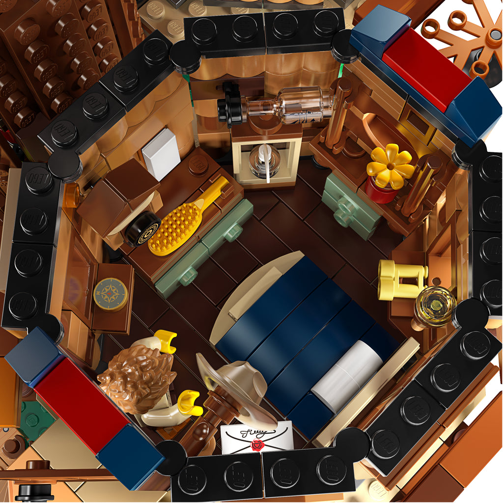 Detailed LEGO model of a living room with furniture and decor.