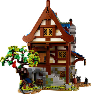 Toy house model made from interlocking bricks on a white background