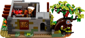 Toy set with a small building, characters, and a tree with green leaves.