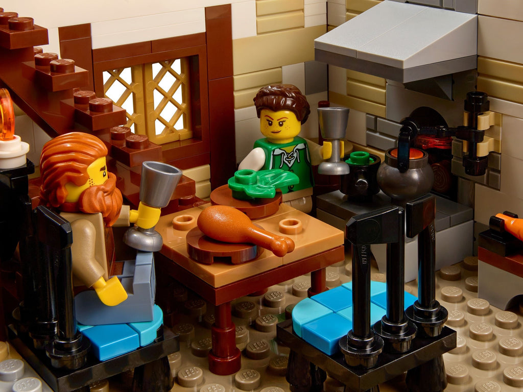 LEGO scene with characters around a table in a kitchen setting