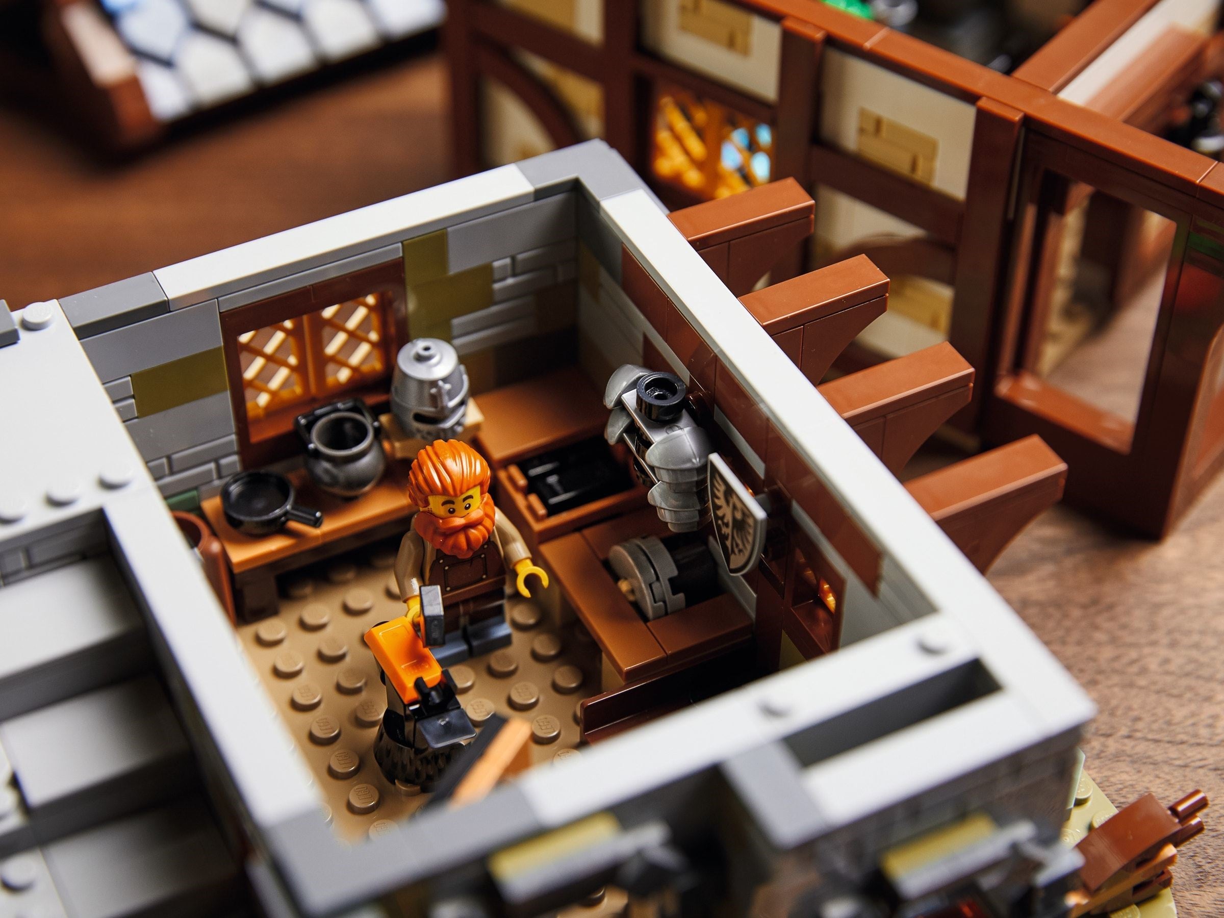 Close-up of a LEGO set with a character in a workshop.