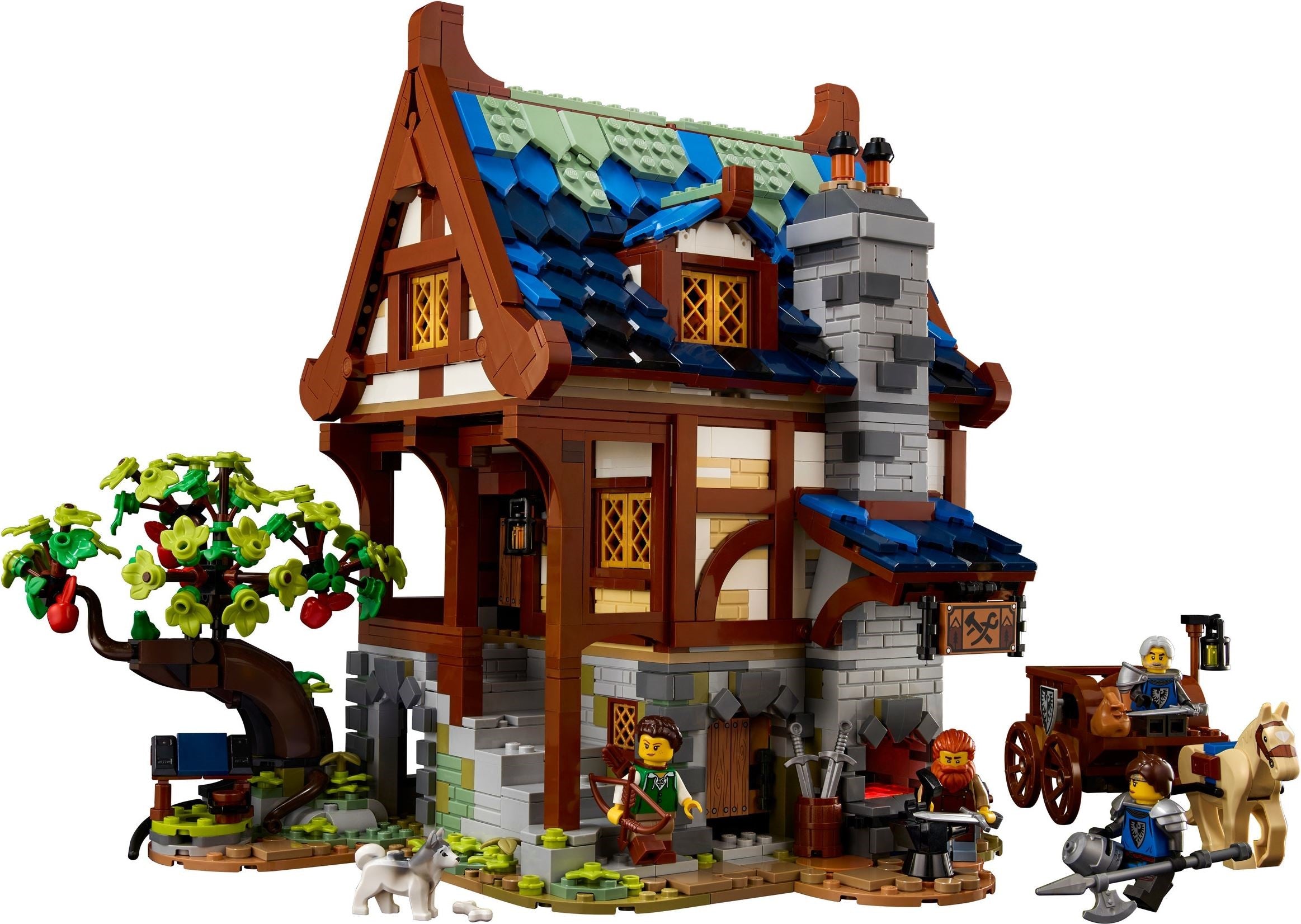 Toy village scene with a house, tree, and figures on a white background