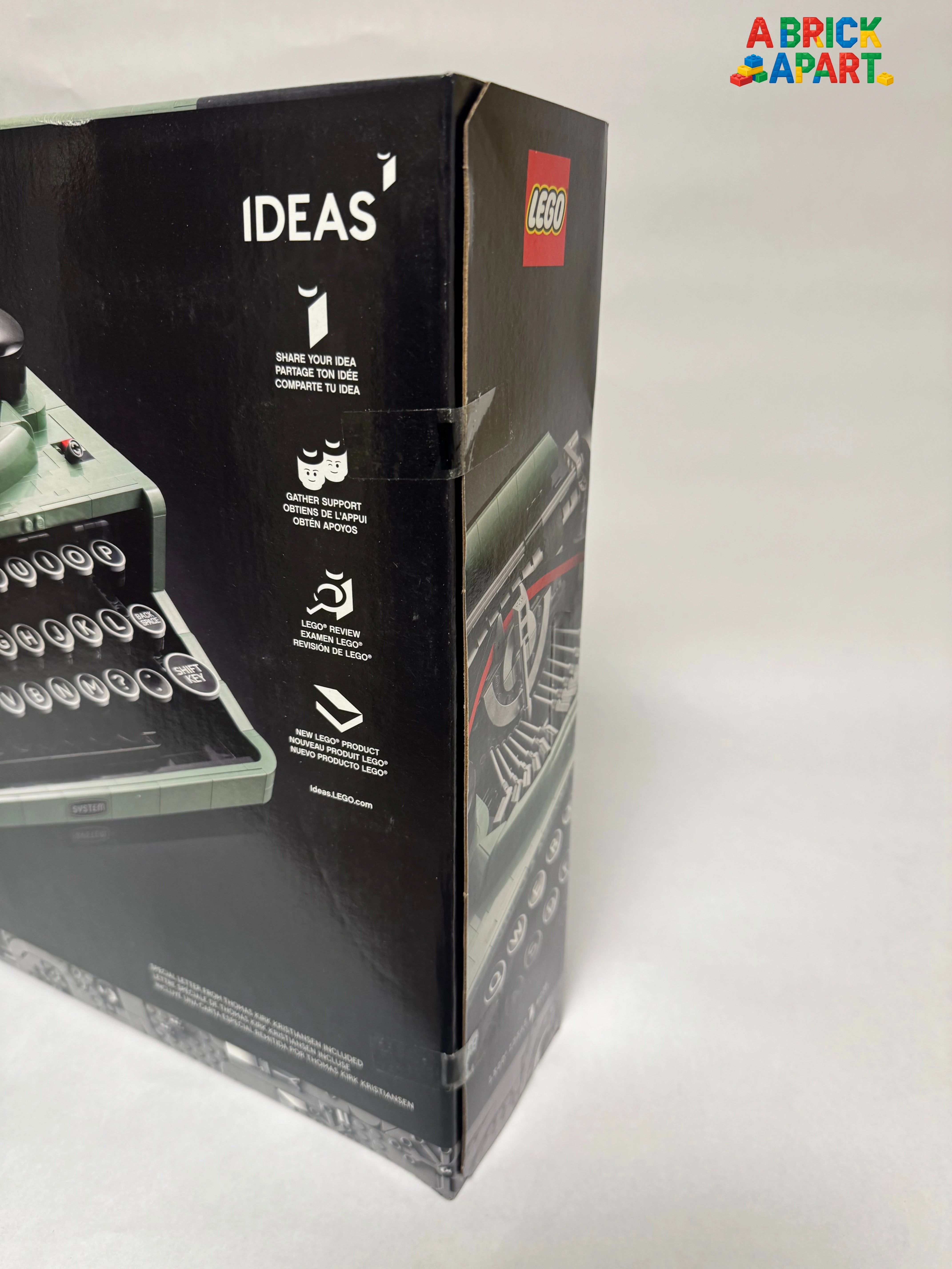 Legos packaging with a typewriter model on a white background