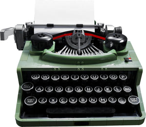 Green typewriter with visible keys on a white background