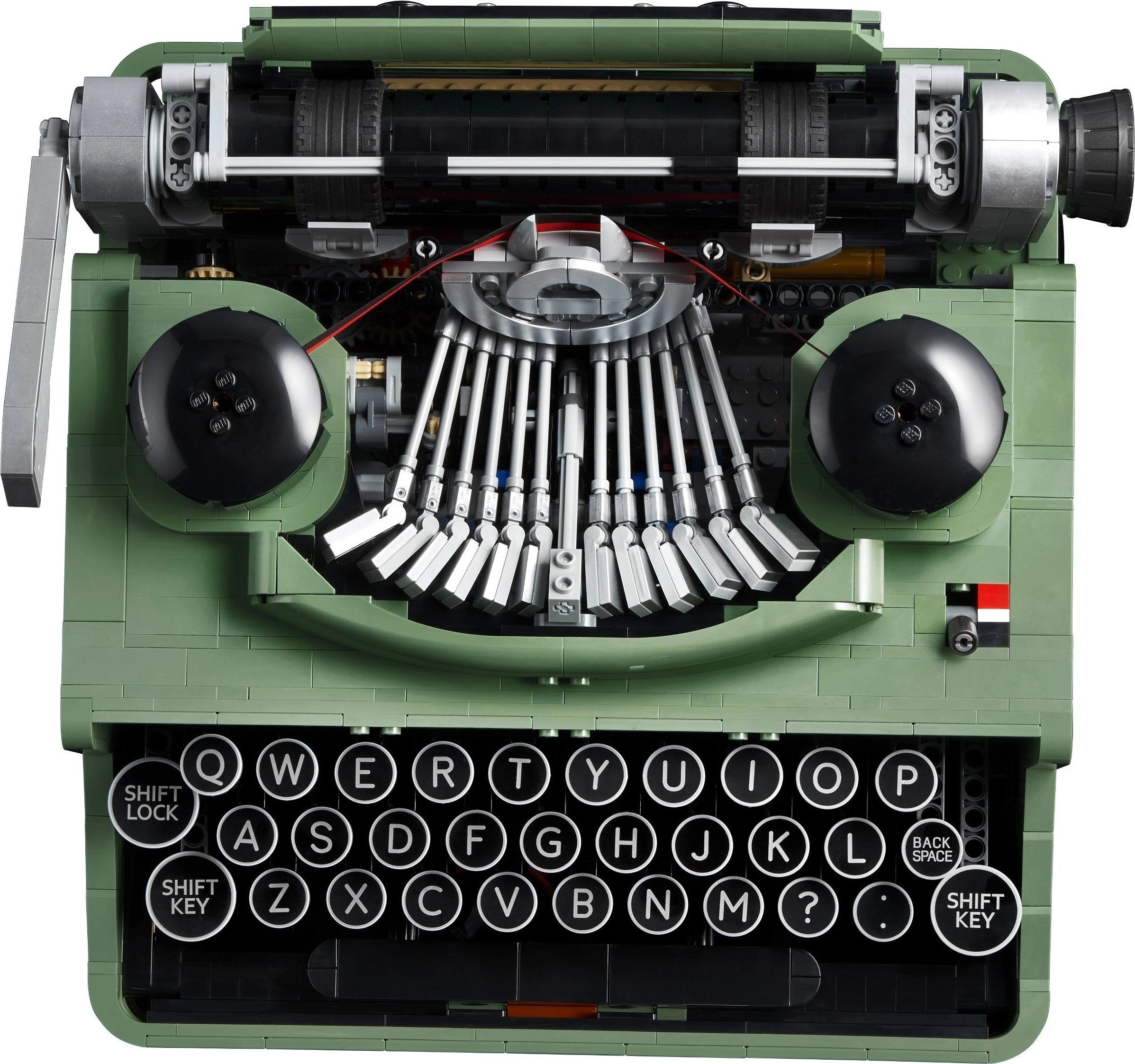 Green typewriter model with intricate mechanical details on a white background
