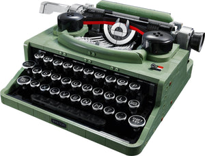 Green typewriter with black keys on a white background