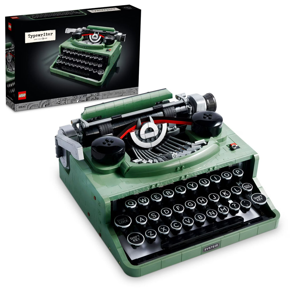 Green typewriter model with open lid showing internal components, next to its packaging.