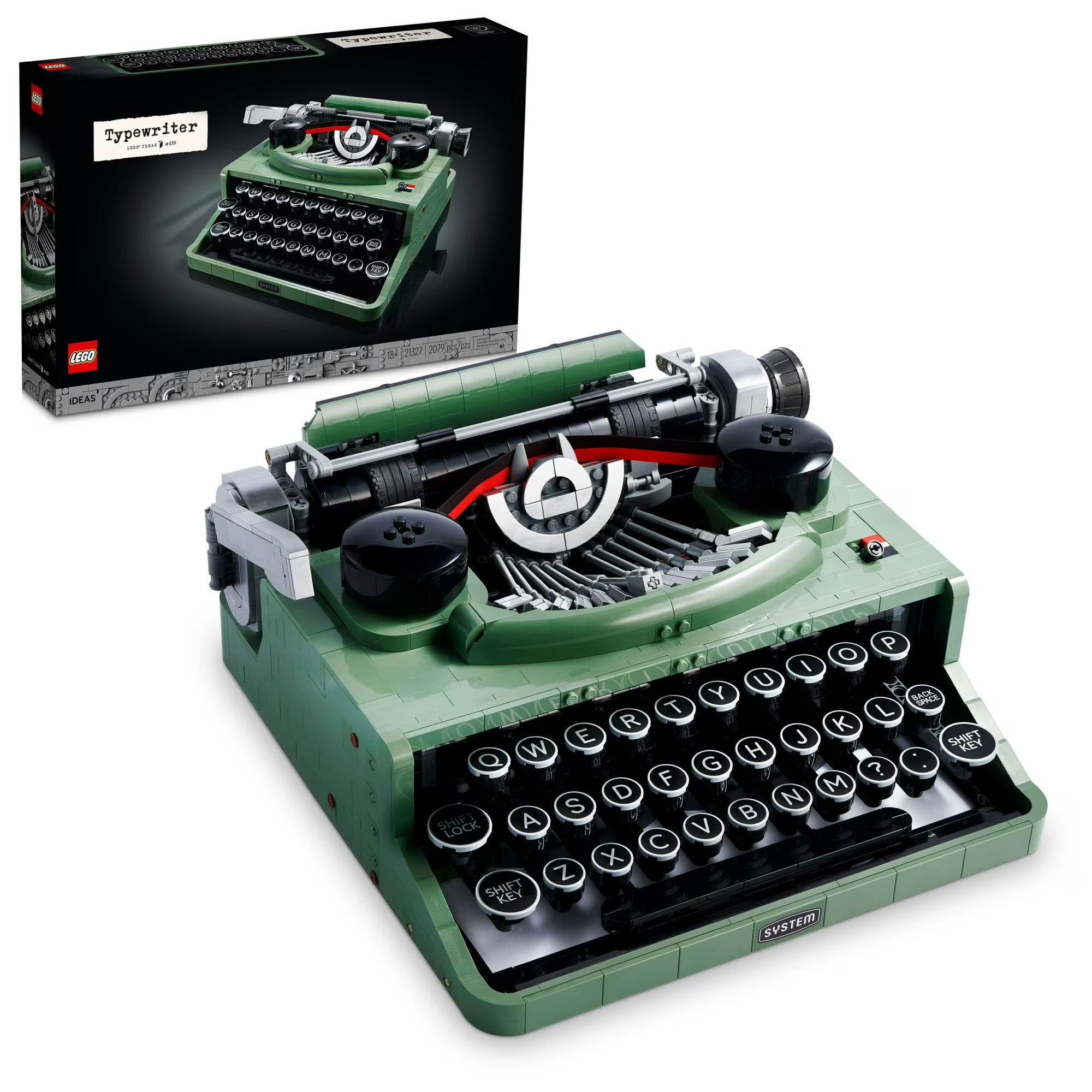 Green typewriter model with open lid showing internal components, next to its packaging.