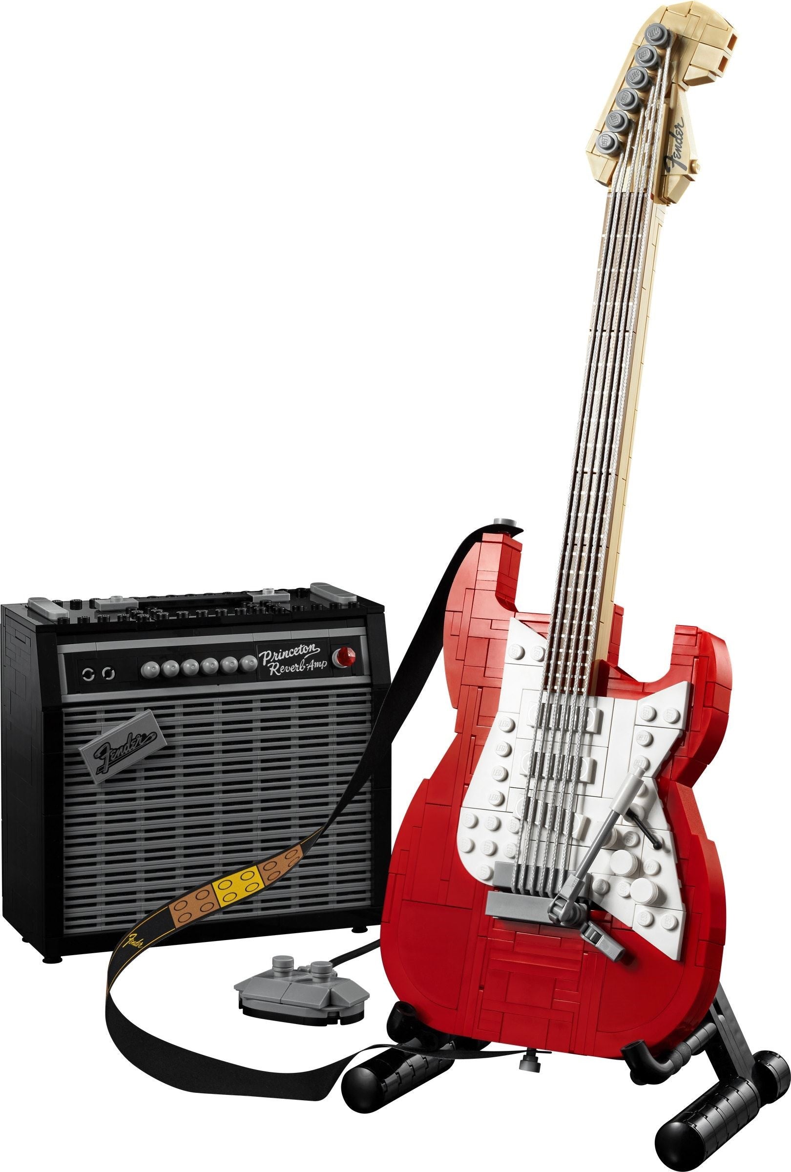 Red electric guitar and amplifier set on a white background