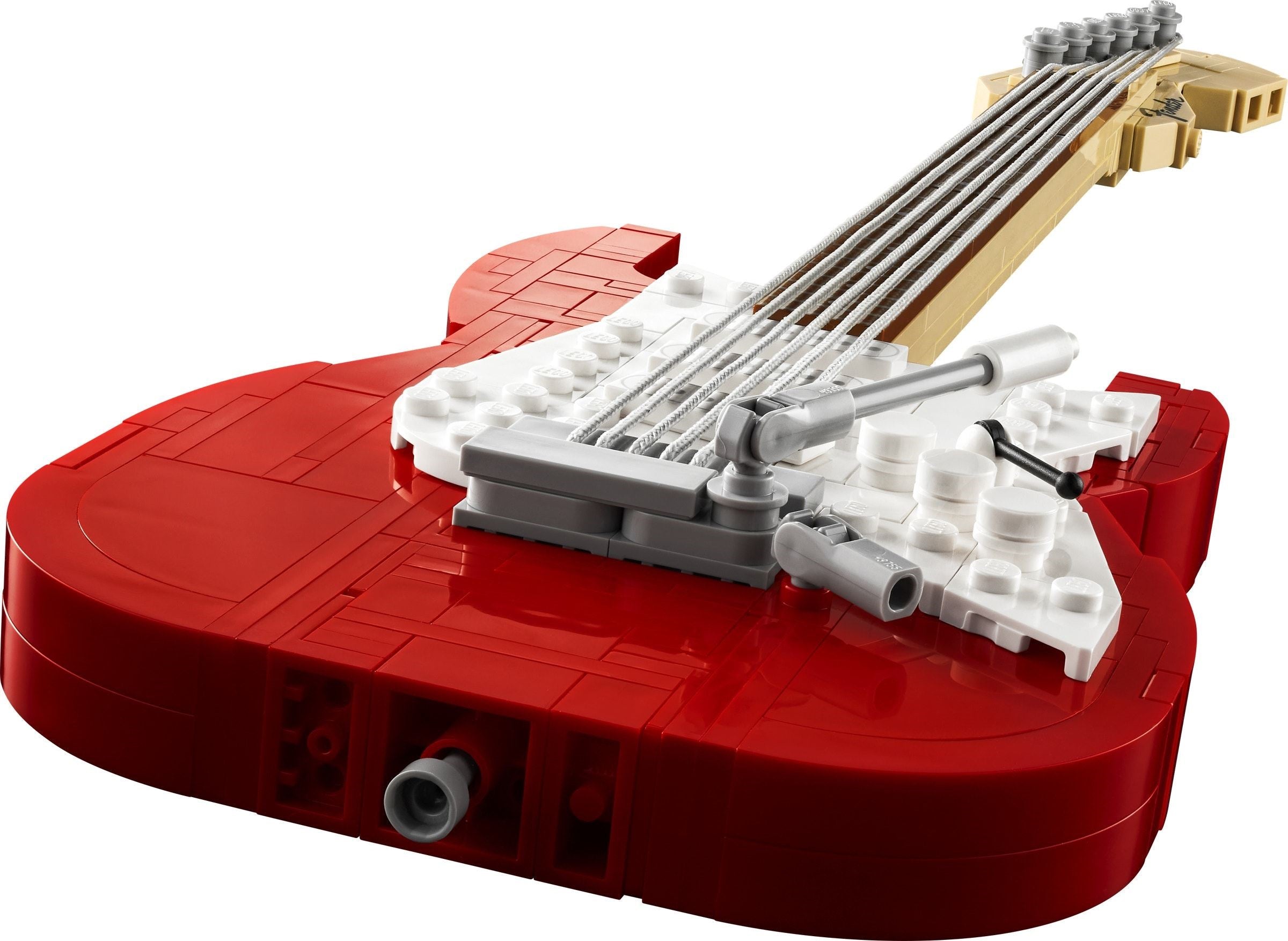 Red guitar model made of interlocking bricks on a white background