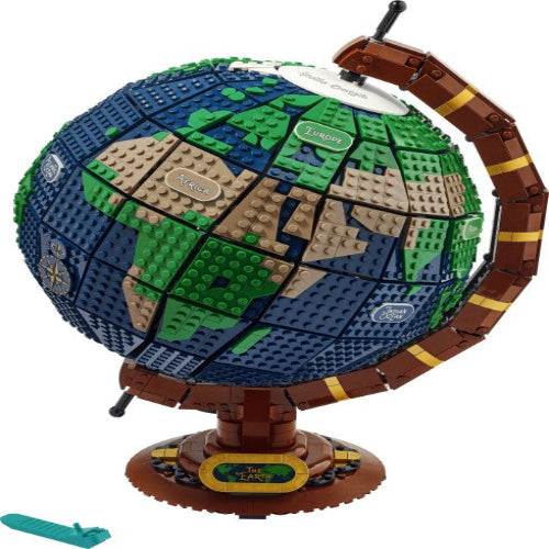 Model of a globe made from interlocking bricks on a white background