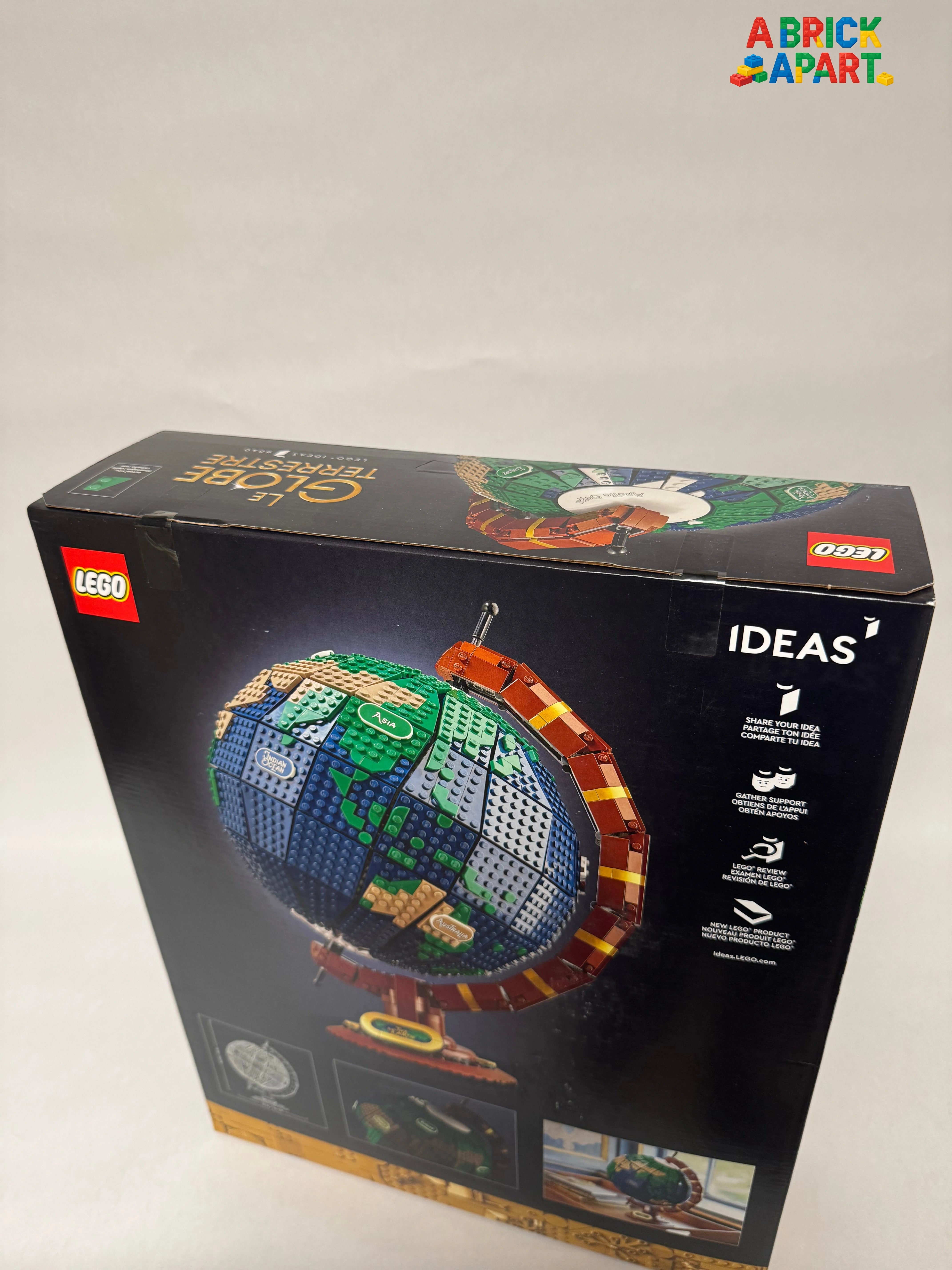 LEGO globe model packaging with branding and product illustration on a white background