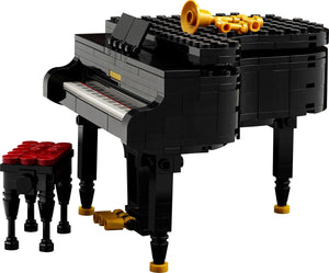 LEGO model of a grand piano with stool on a white background