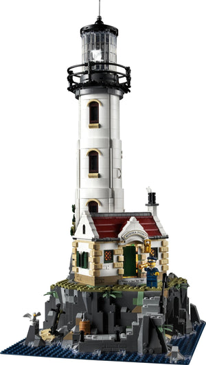 Model of a lighthouse made from interlocking bricks on a white background