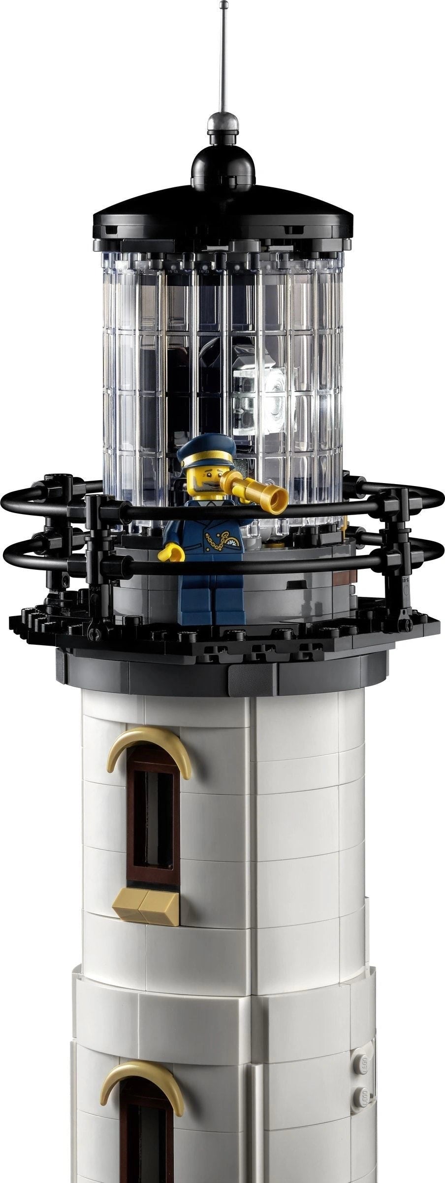 Model of a lighthouse made from interlocking bricks on a white background