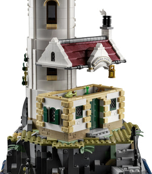 Close-up of a detailed model building with architectural elements on a white background