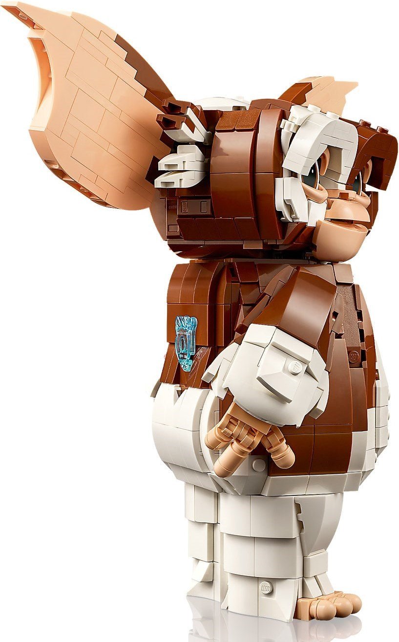 Toy figure made of interlocking bricks with a brown and white design on a white background