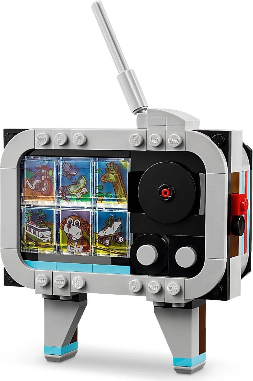Toy robot with screen displaying images on a white background
