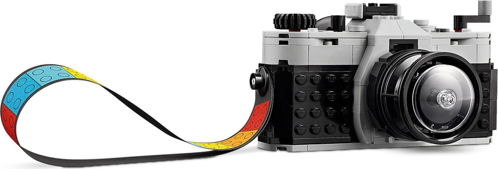 LEGO camera model with a strap on a white background