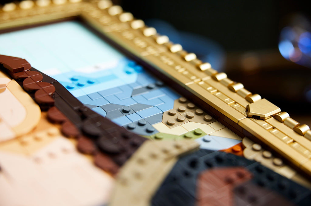 Close-up of a LEGO model with a detailed face and gold frame.