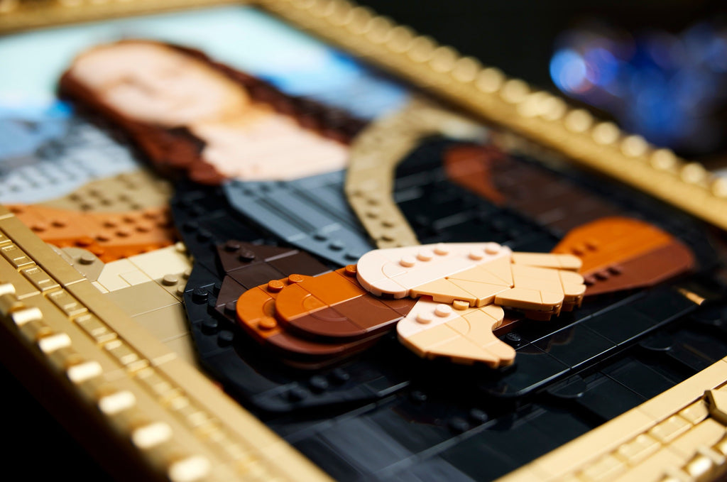 Close-up of a guitar model made from interlocking plastic bricks on a blurred background