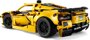 Yellow toy car model on a white background