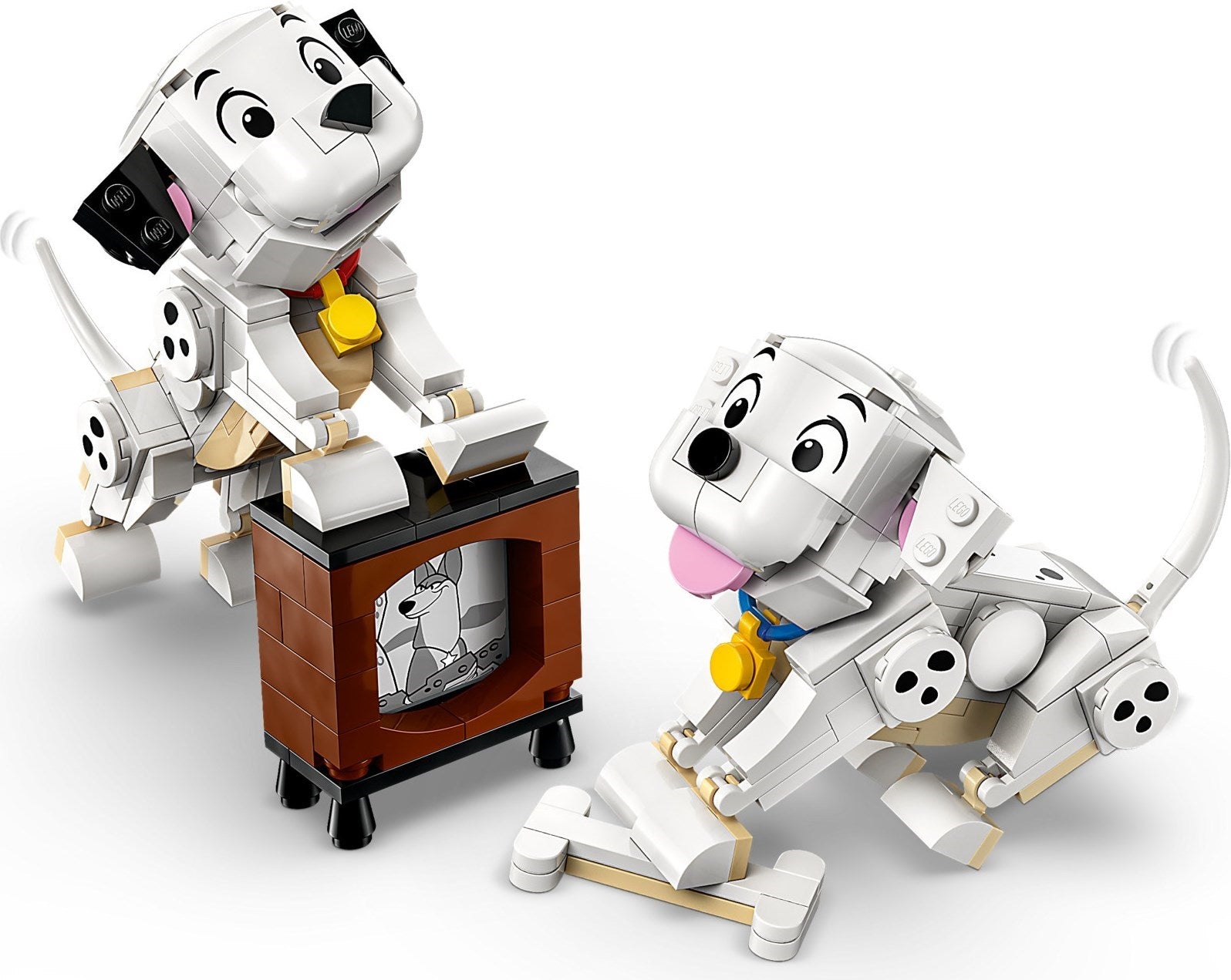 Two LEGO dog figures with a TV set on a white background