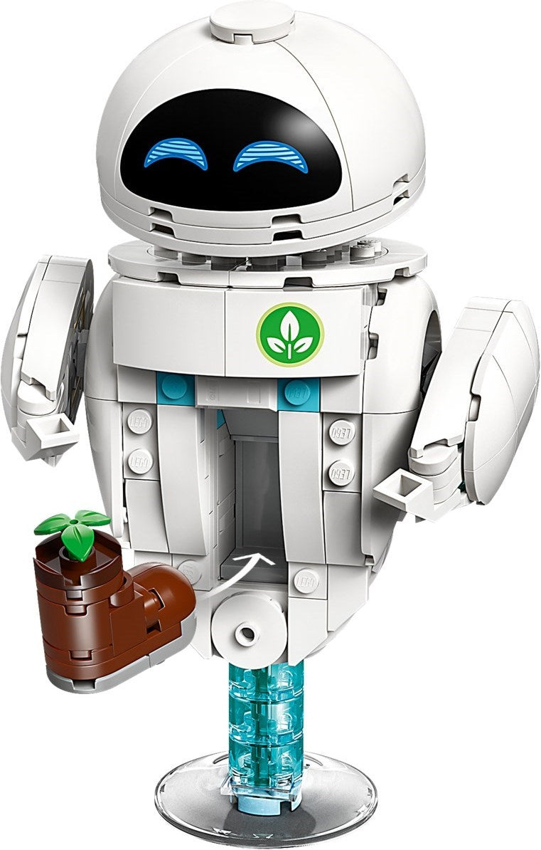 Toy robot with a plant and crystal on a white background