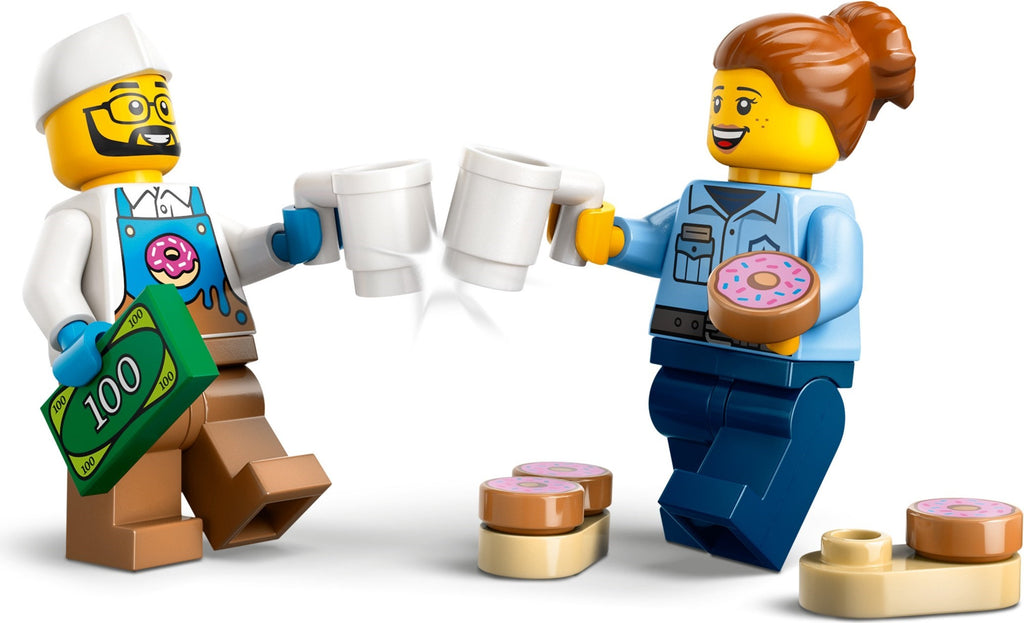 Two LEGO figures, one holding a cup and the other with a donut, on a white background