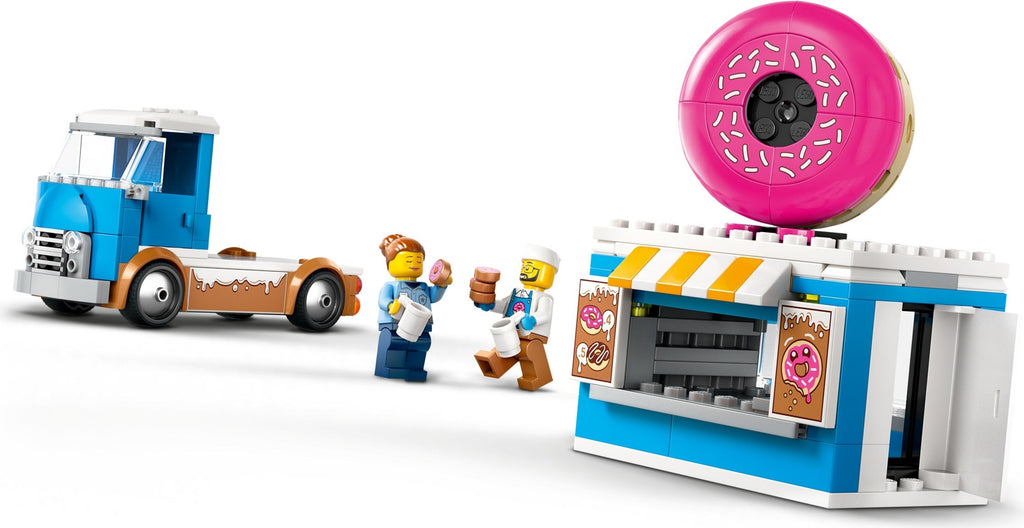 Toy set with a blue truck, donut shop, and figures on a white background