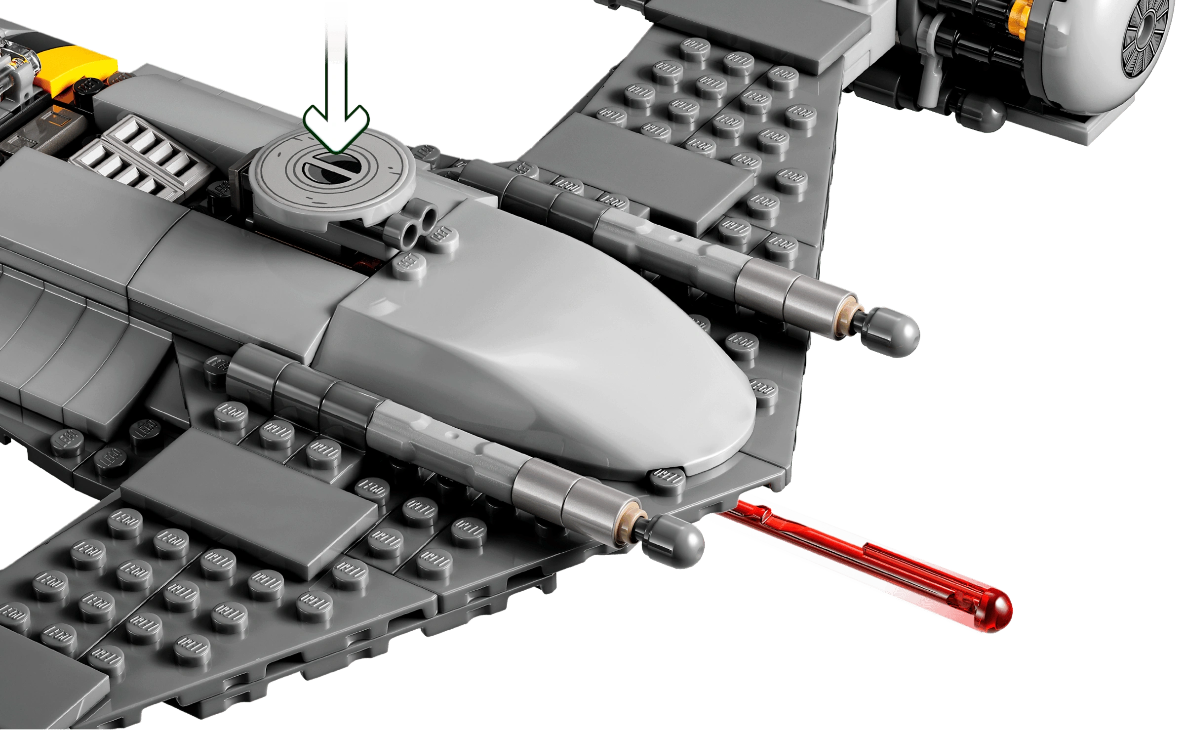Close-up of a LEGO model of a spaceship with a red laser cannon on a white background