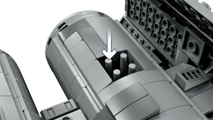 Close-up of a mechanical component with cylindrical parts and an arrow indicating direction.