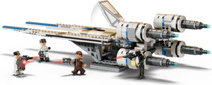 Toy model of a spaceship with figures in front, resembling a LEGO set.
