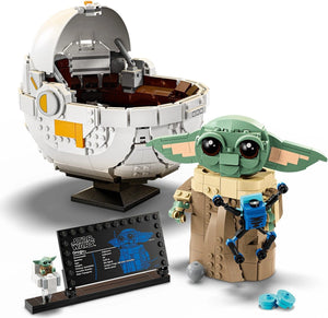 LEGO Baby Yoda figure and Death Star model on a white background