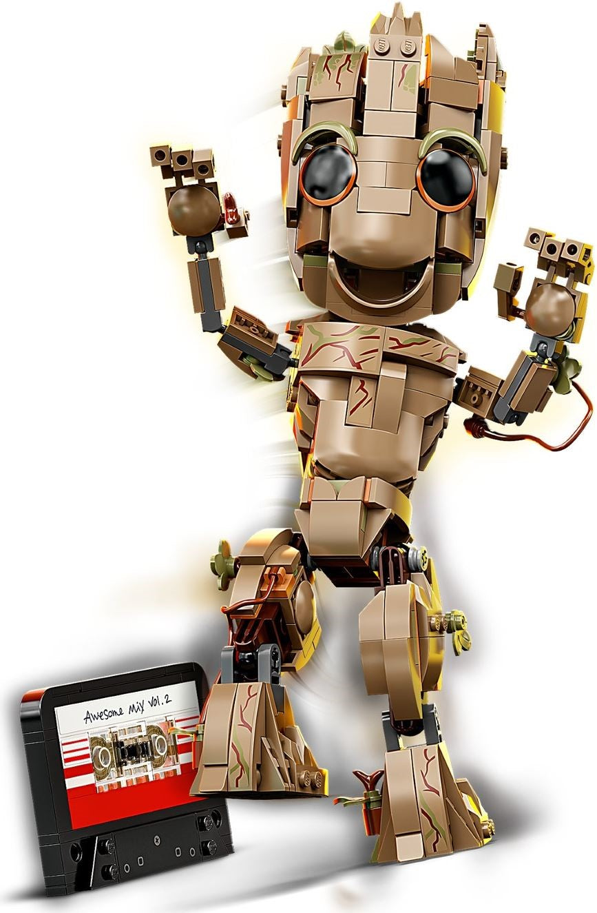 Toy robot figure with a cassette tape on a white background