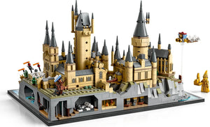 Detailed LEGO model of a castle with multiple towers and structures on a white background