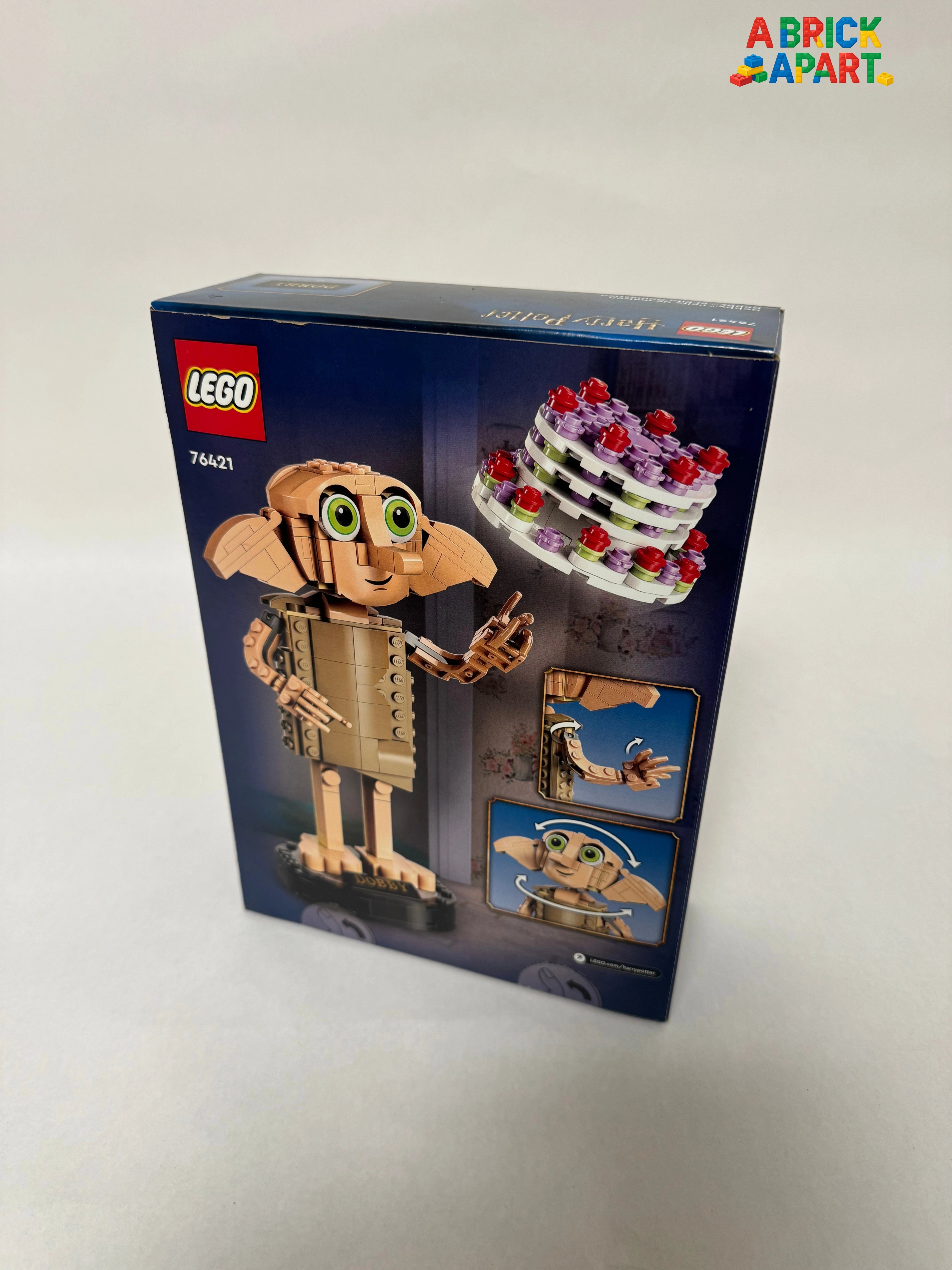 LEGO box featuring a character with green eyes and a cake on a white background