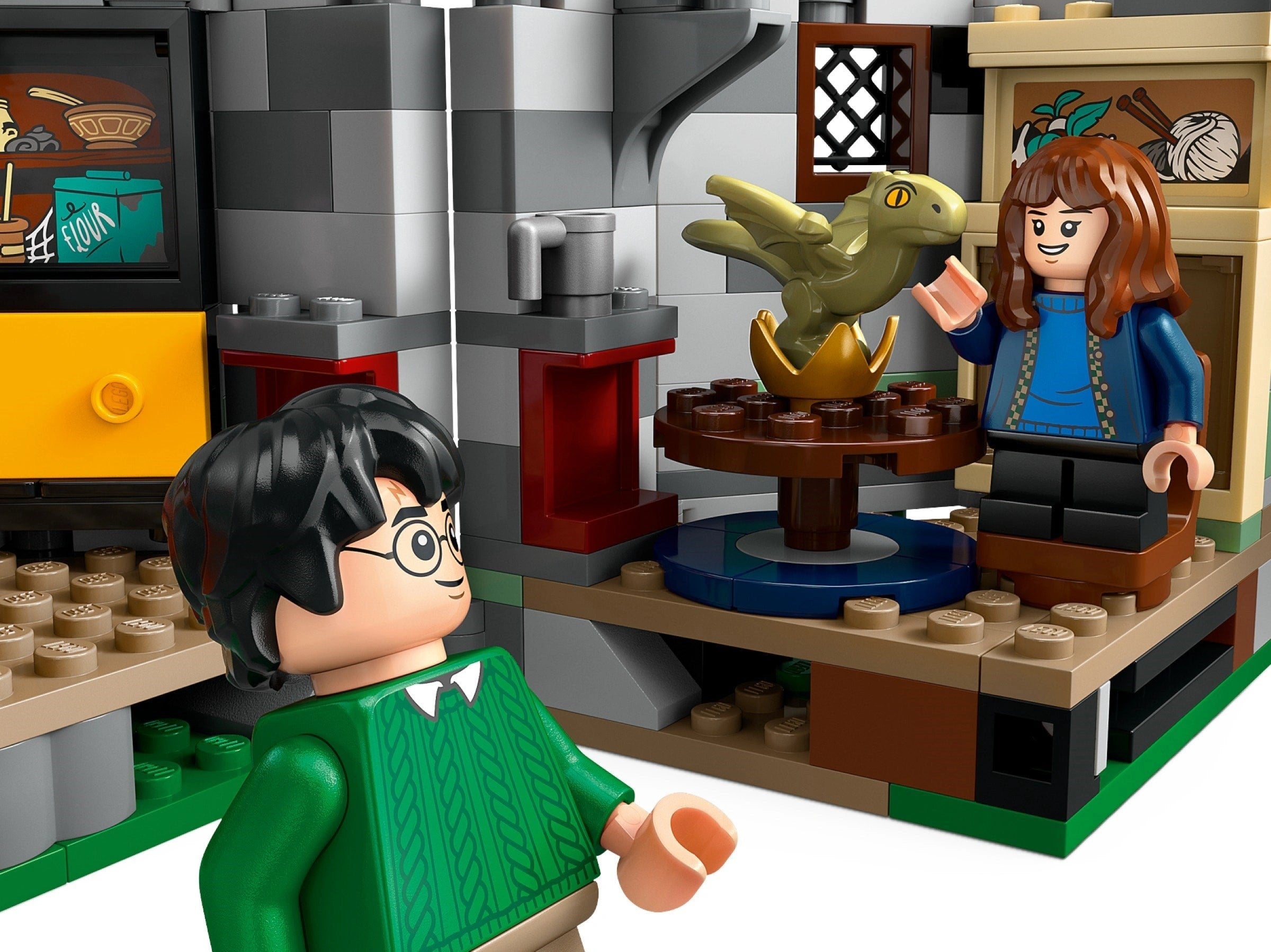 LEGO figures of a boy and girl with a dragon and golden egg in a classroom setting