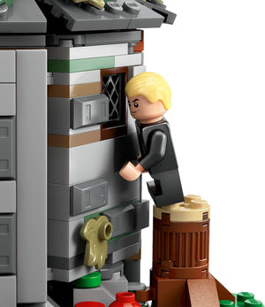 LEGO figure interacting with a detailed building model on a white background