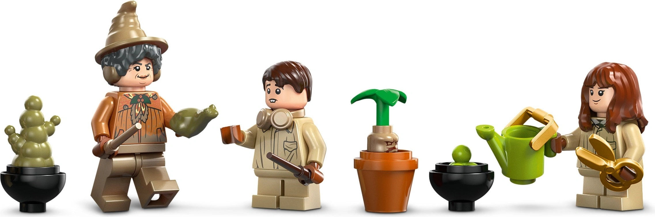 Toy figures of a gardener, a child, and a woman with gardening tools and plants on a white background