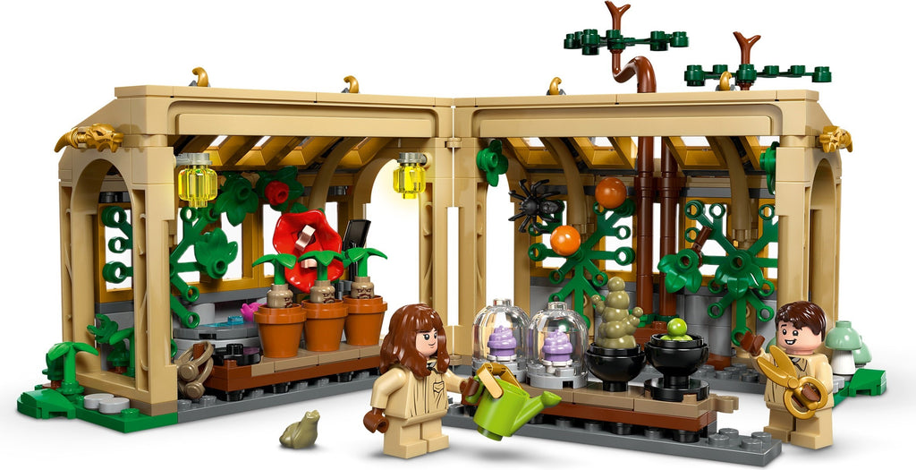 LEGO model of a greenhouse with plants and characters on a white background