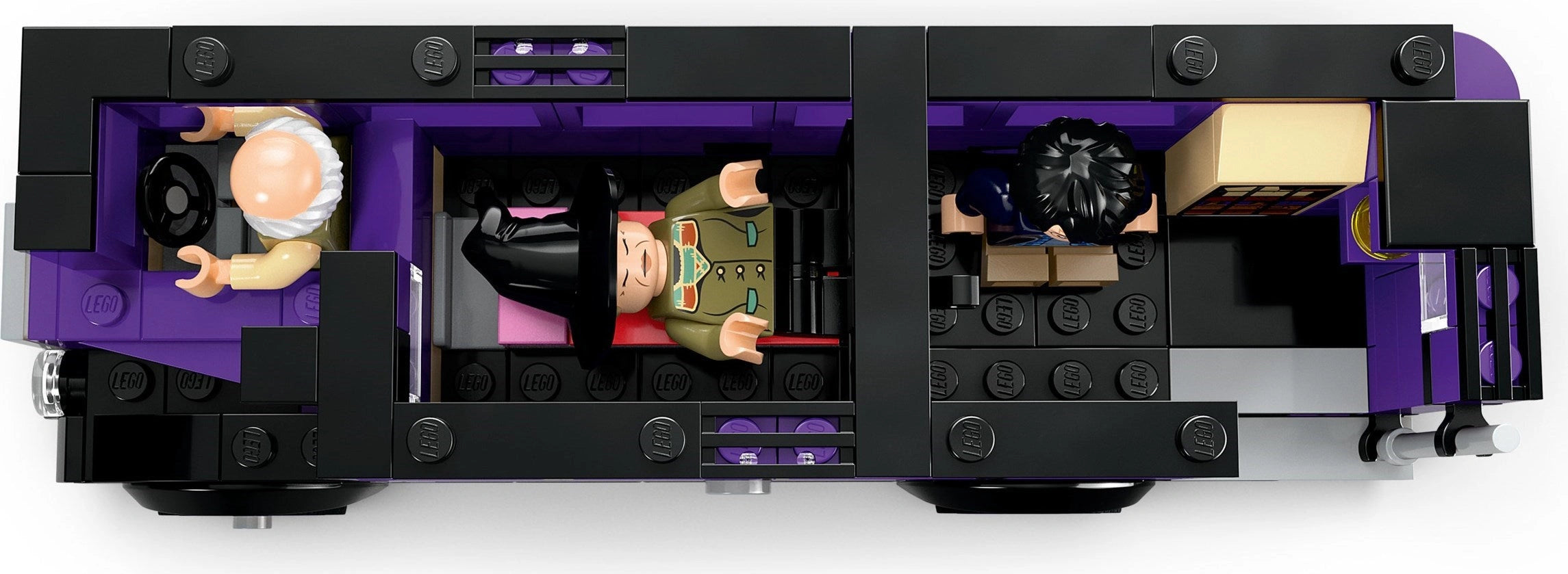 Close-up of a LEGO vehicle with detailed interior and characters on a white background