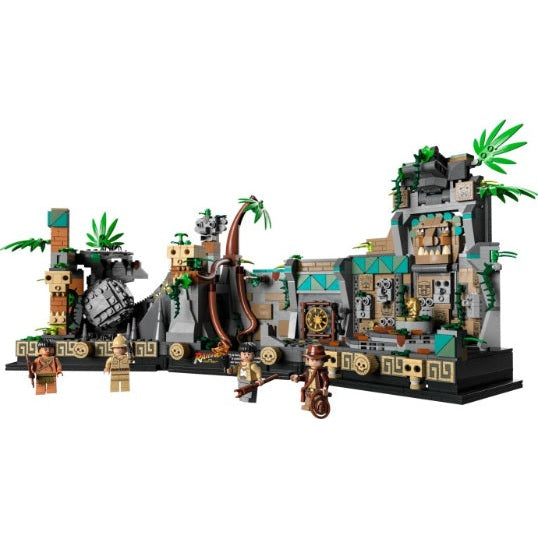 Complex LEGO model of a jungle temple with figures and greenery on a white background