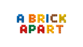 Colorful building blocks spelling 'A Brick Apart' on a textured surface.