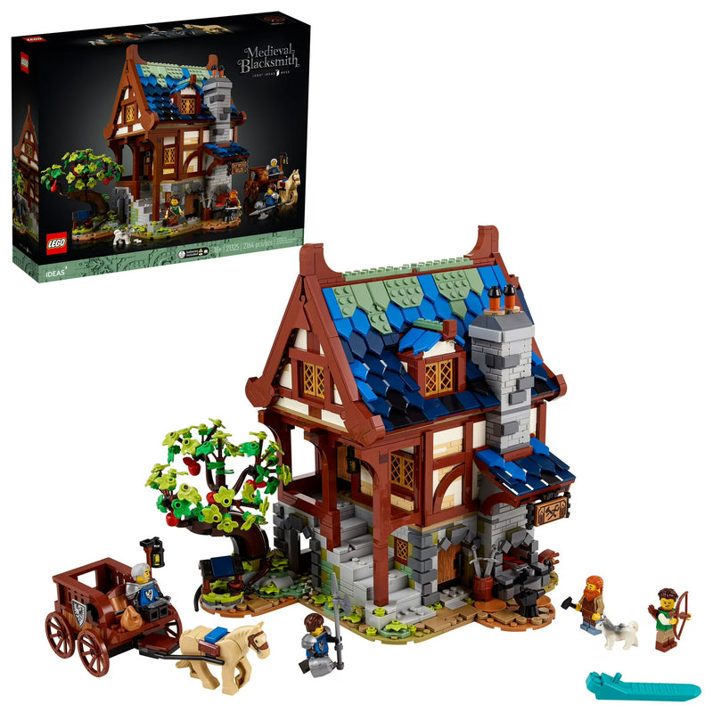 LEGO model of a medieval house with accessories and packaging on a white background