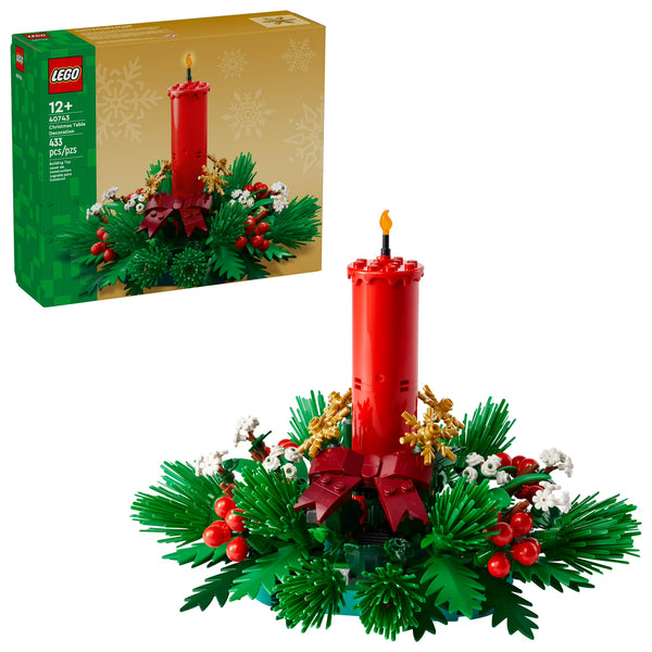 Christmas-themed LEGO set with red candle and greenery, including packaging.
